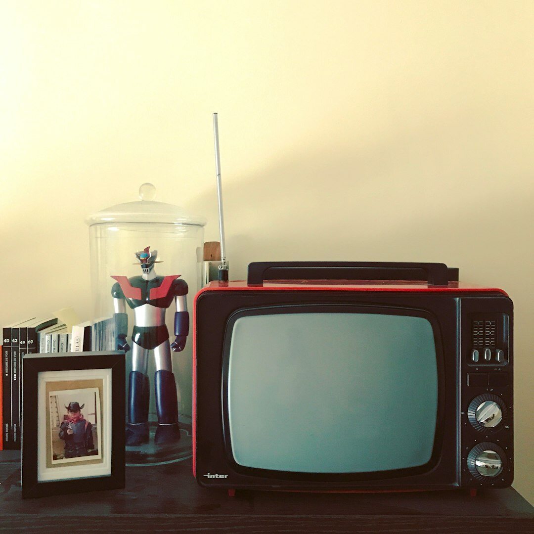 Vintage television broadcasting a colourful commercial